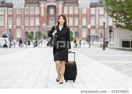 Young woman in a suit walking walk with a carry back Business Tokyo Station 45859903