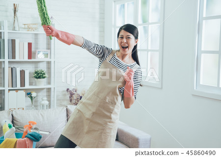 housewife wearing apron doing superman pose housewife wearing apron doing superman pose 45860490