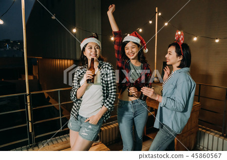 asian ladies celebrating christmas eve on roof asian ladies celebrating christmas eve on roof 45860567