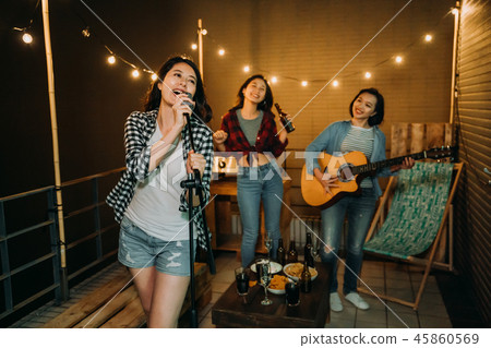 band playing music practicing songs on roof. 45860569