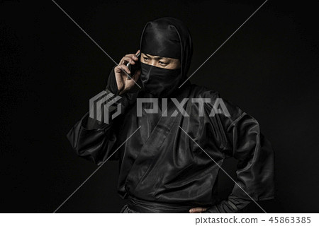 A ninja talking on the smart phone A ninja talking on the smart phone 45863385