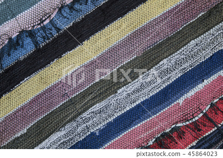 Traditional rustic carpet with a striped pattern. Traditional rustic carpet with a striped pattern. 45864023