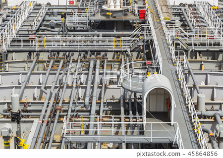 Pipes of the cargo system on the deck of the oil product vessel. Pipes of the cargo system on the deck of the oil product vessel. 45864856