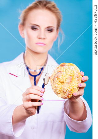 dietitian examine sweet roll bun with stethoscope dietitian examine sweet roll bun with stethoscope 45867312