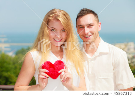 Happy romantic couple with holding heart Happy romantic couple with holding heart 45867313