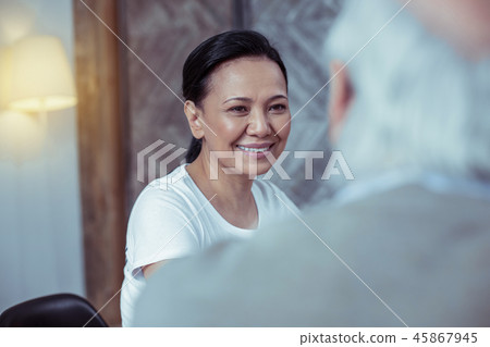 Positive delighted Asian female spending time while volunteering 45867945