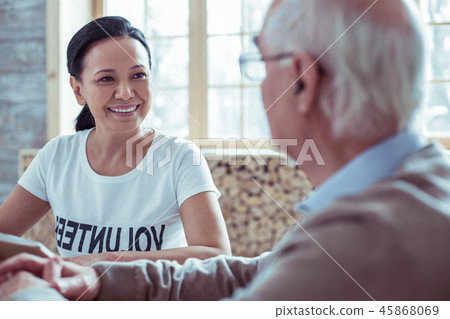 Joyful brunette female person having pleasant talk 45868069