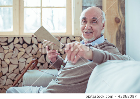 Positive delighted male person spending pause with pleasure 45868087