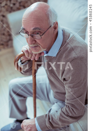 Top view picture of old man that sitting on sofa 45868145