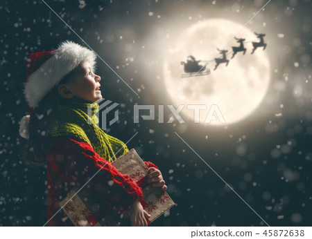 girl with present at Christmas girl with present at Christmas 45872638