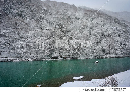 Katsura river in winter during snowfall that turns white in a snowy landscape Katsura river in winter during snowfall that turns white in a snowy landscape 45873271