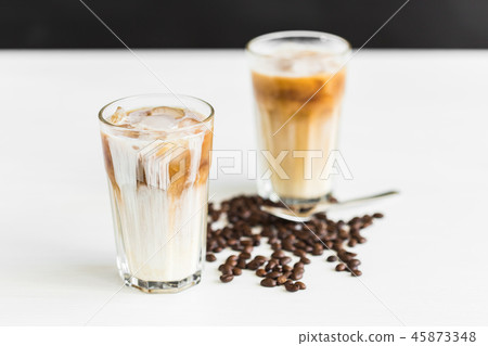 Delicious drink concept - Iced coffee in a glass with ice. Delicious drink concept - Iced coffee in a glass with ice. 45873348