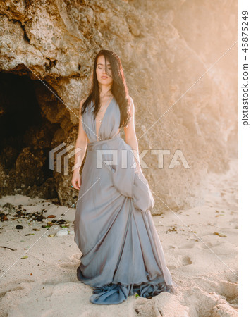 Fashion woman. Brunette woman posing in dress Fashion woman. Brunette woman posing in dress 45875249