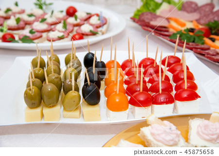 Close up of small canapes arranged on a plate 45875658