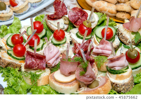 Close up of small canapes arranged on a plate Close up of small canapes arranged on a plate 45875662