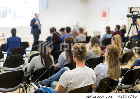 Professor lecturing in lecture hall at university. Professor lecturing in lecture hall at university. 45875780