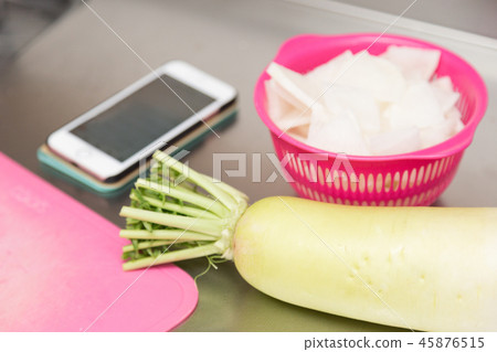 Radish and smartphone 45876515