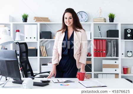 Portrait of the waist of a young girl in a bright office. Portrait of the waist of a young girl in a bright office. 45876625