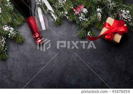 Christmas card with champagne, gift and fir tree 45876859