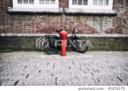 Bicycle near the red fire hydrant in Holland 45879270
