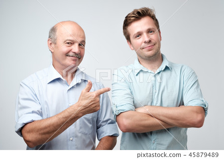 Senior father is proud of his mature son. Senior father is proud of his mature son. 45879489
