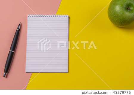 Blank spiral notebook on a colorful office desk Blank spiral notebook on a colorful office desk 45879776