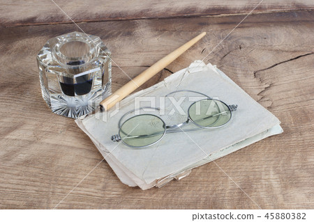 Old fountain pen and inkwell with old letters  45880382