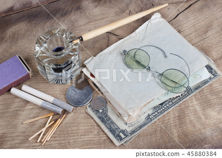 Old fountain pen and inkwell with old letters  45880384