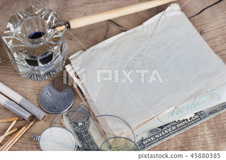 Old fountain pen and inkwell with old letters  45880385