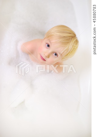 Cute little boy taking a foam bubble bath  45880783
