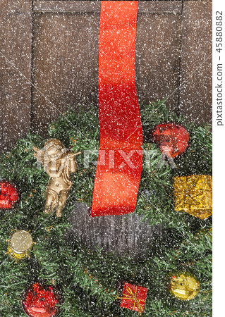 Christmas wreath on the door of a wooden house Christmas wreath on the door of a wooden house 45880882