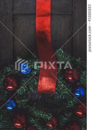 Christmas wreath on the door of a wooden house Christmas wreath on the door of a wooden house 45880883