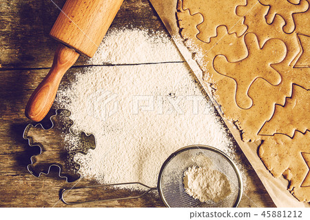 table rolled out dough, flour, Christmas shapes 45881212