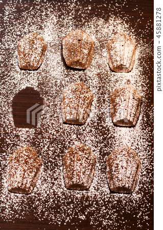 Madeleine cake in dark background Madeleine cake in dark background 45881278