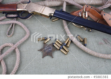 Wild west rifle with ammunition and sheriff badge 45881381
