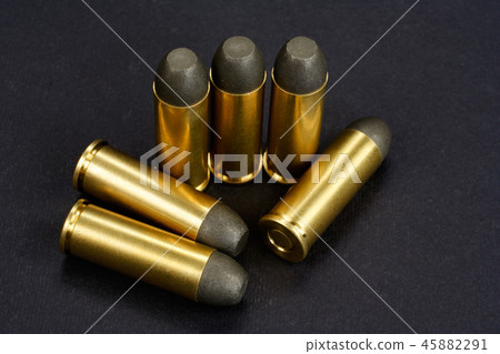 The .45 caliber revolver cartridges on black  45882291
