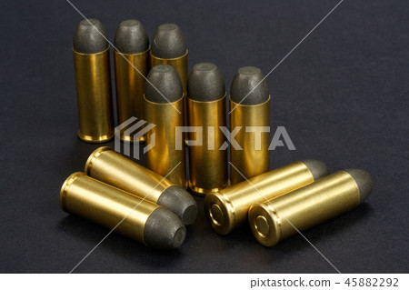 The .45 caliber revolver cartridges on black  45882292