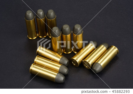 The .45 caliber revolver cartridges on black  45882293