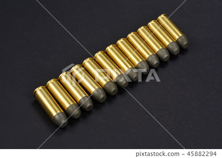 The .45 caliber revolver cartridges on black  45882294