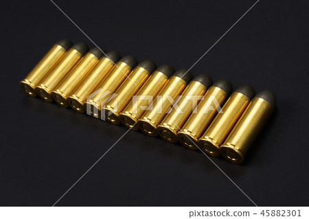The .45 caliber revolver cartridges on black  45882301