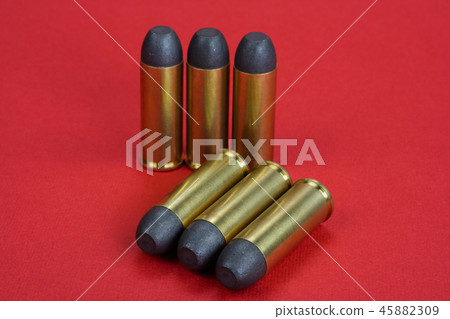 The .45 caliber revolver cartridges on red  45882309