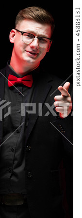 Portrait of confident handsome elegant responsible businessman pointing at camera on black Portrait of confident handsome elegant responsible businessman pointing at camera on black 45883131