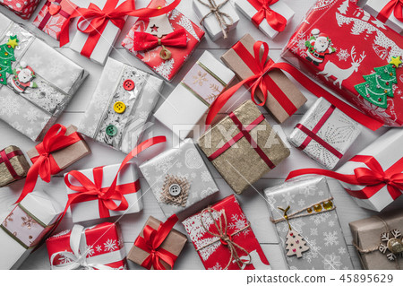 Gift pattern on a dark wooden holiday background. Gift pattern on a dark wooden holiday background. 45895629