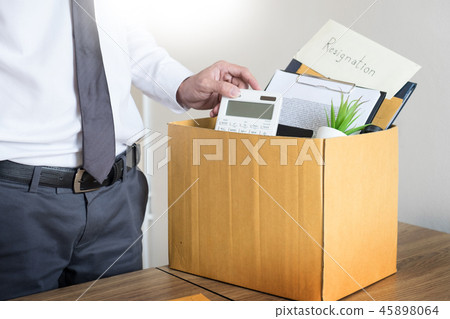 Businessmen are holding resignation document and packing persona 45898064
