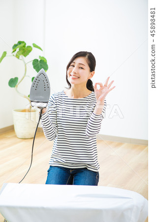 Woman with an iron 45898481