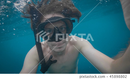 A young caucasian snorkeling man underwater selfie. A young caucasian snorkeling man underwater selfie. 45898802