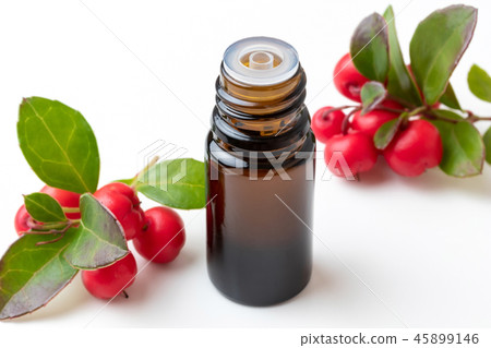 A bottle of wintergreen essential on white table 45899146