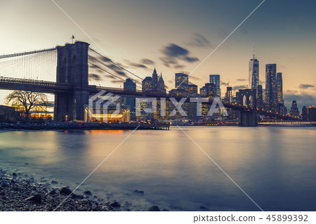 Brooklyn bridge East river and Manhattan at dusk 45899392