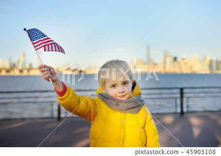 Little boy holding the American flag  45903108