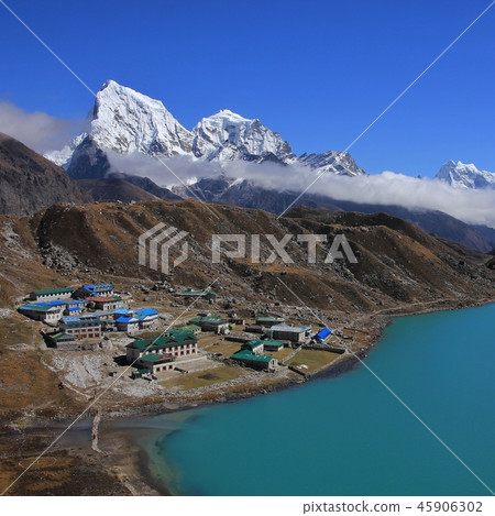Turquoise Gokyo lake, village and Cholatse. 45906302